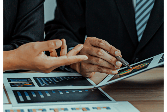 Two people discussing business setup services in India, HR infrastructure, and compliance