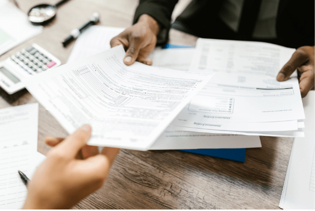 Man and woman reviewing post-company registration services, HR policies, and compliance in India