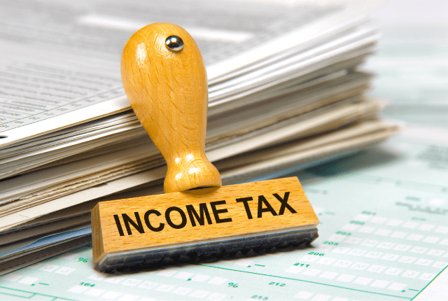Income Tax stamp symbolizing regulatory compliance advisory services for businesses in India