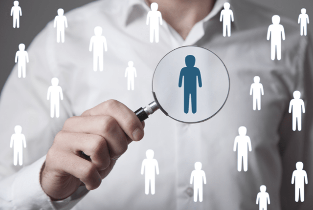 Magnifying glass highlighting talent acquisition and recruitment services for business roles in India